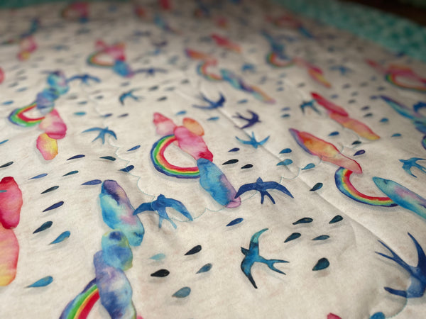 Rainbow Showers Quilted Blanket