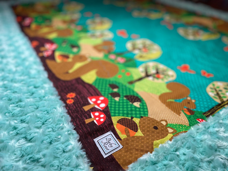 Squirrels in the Garden Quilted Blanket